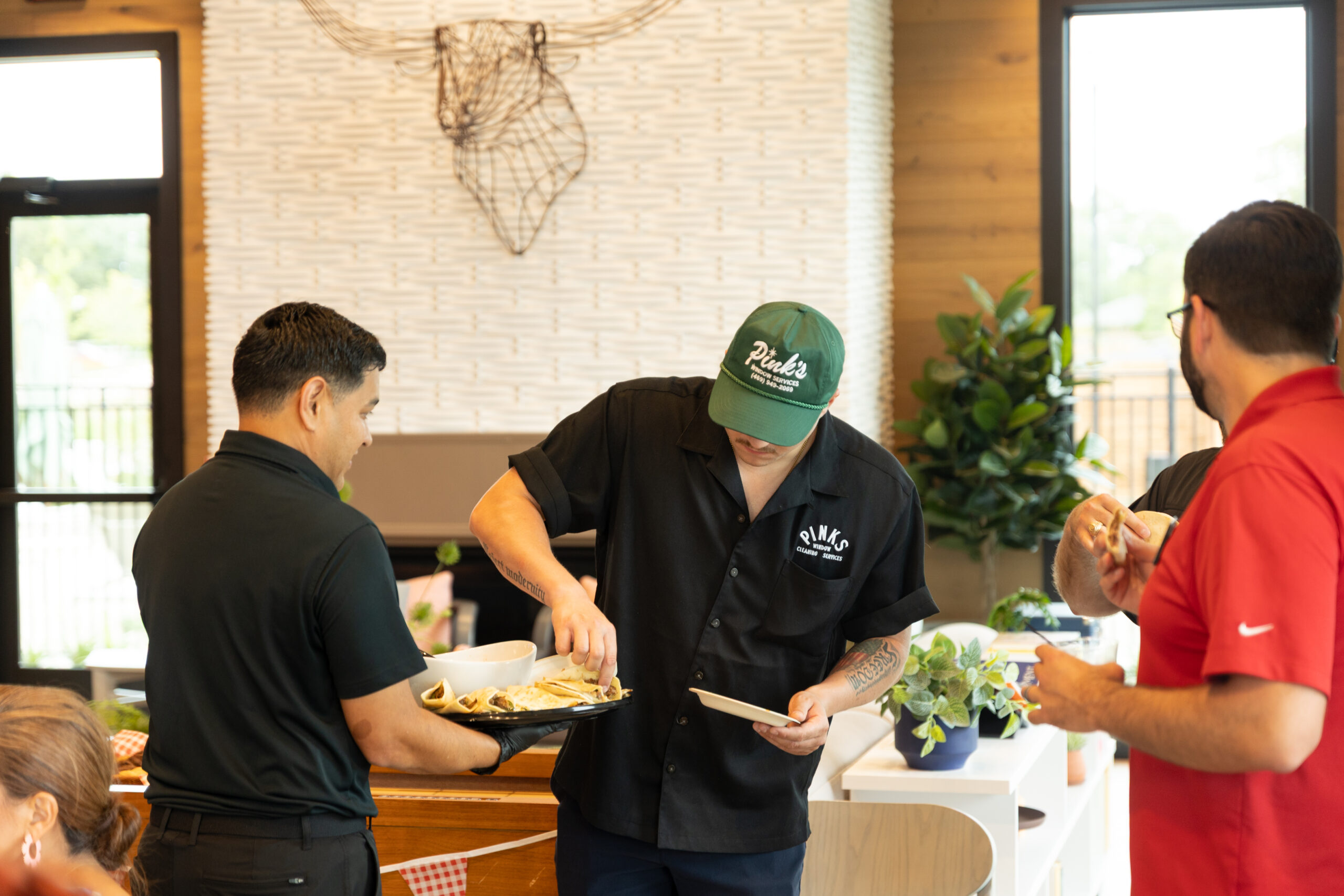 Easy Catering DTX staff serving tacos at a buffet line