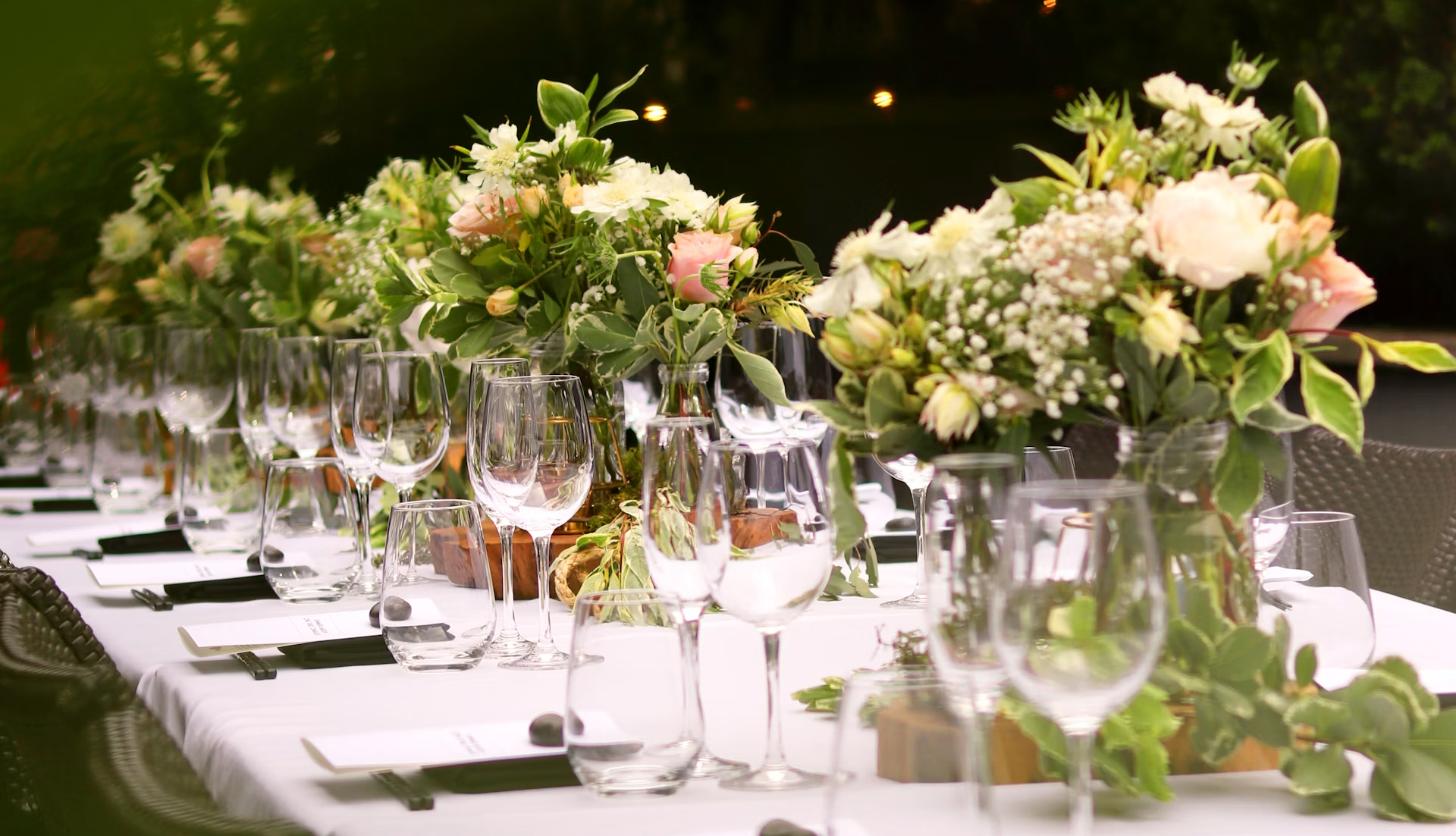 Wedding reception table with floral centerpieces